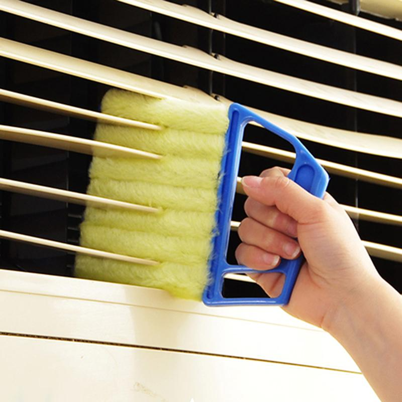 Cleaning brush for tight spaces with reusable microfiber covers