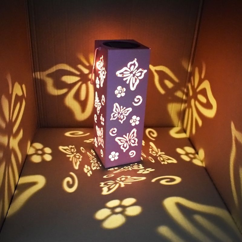 Decorative outdoor lamp with butterfly and flower design