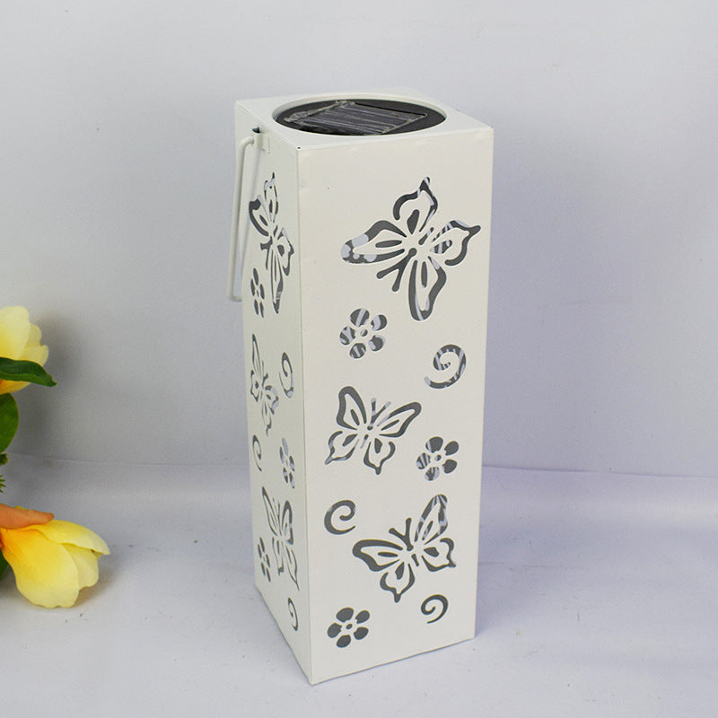 Decorative outdoor lamp with butterfly and flower design